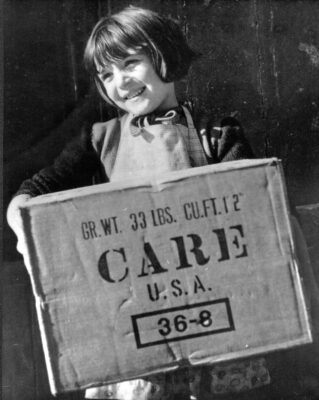 Regine Binet of Bayeux, France, a town not far from the Normandy invasion beaches, receives a CARE Package in 1946, a gift from an American she had never met. 